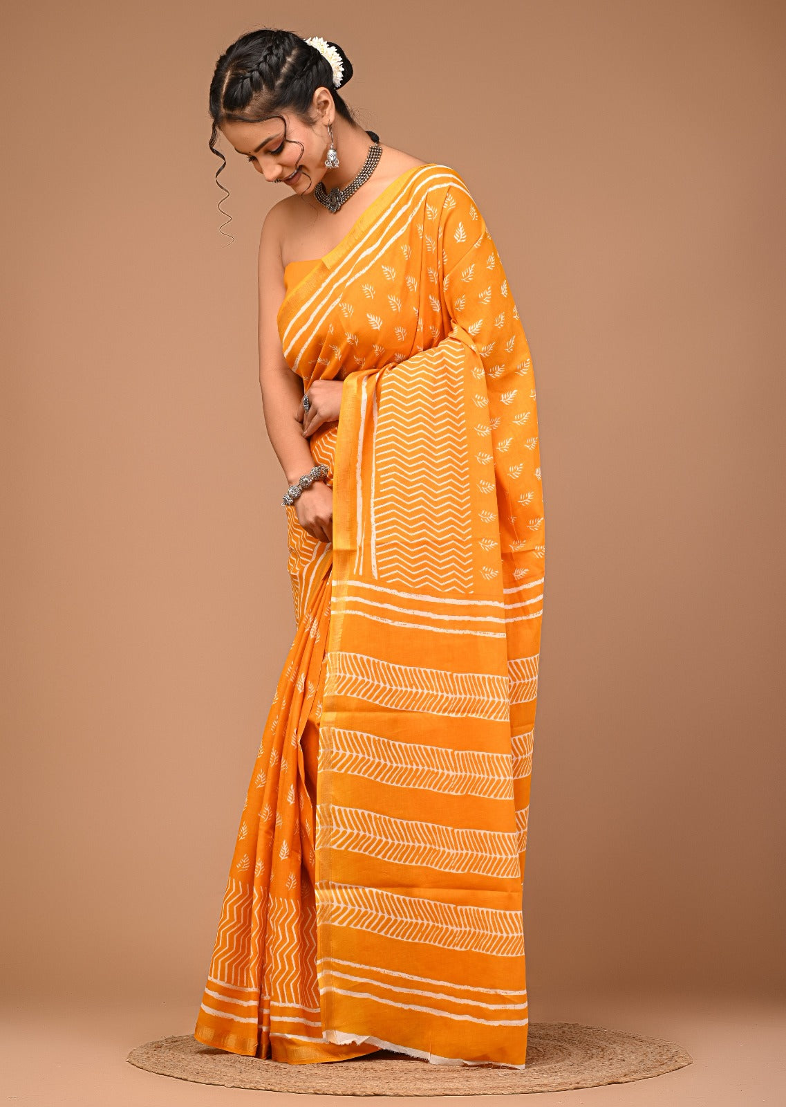 Jodha Ajrakh print zari border saree