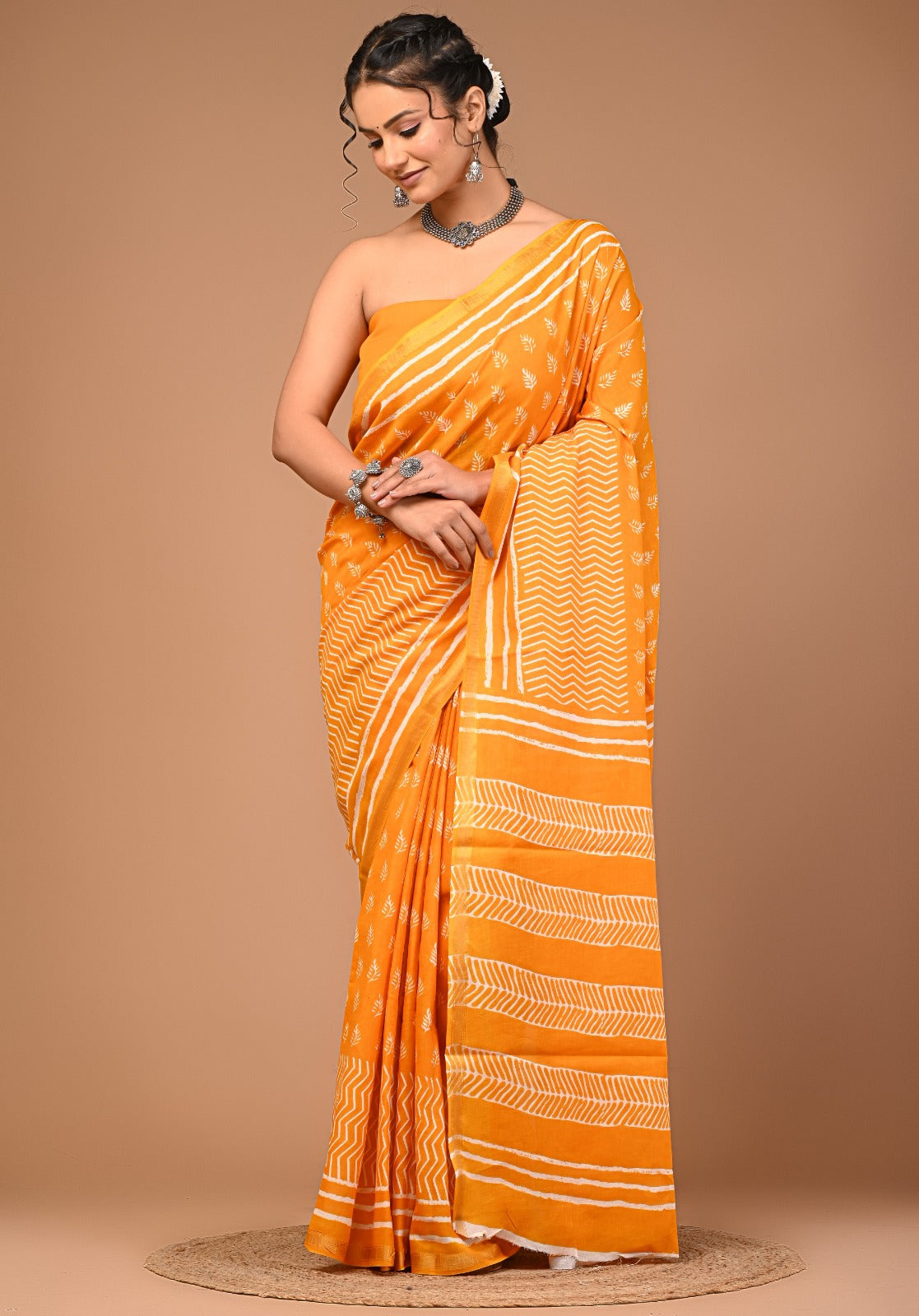 Jodha Ajrakh print zari border saree